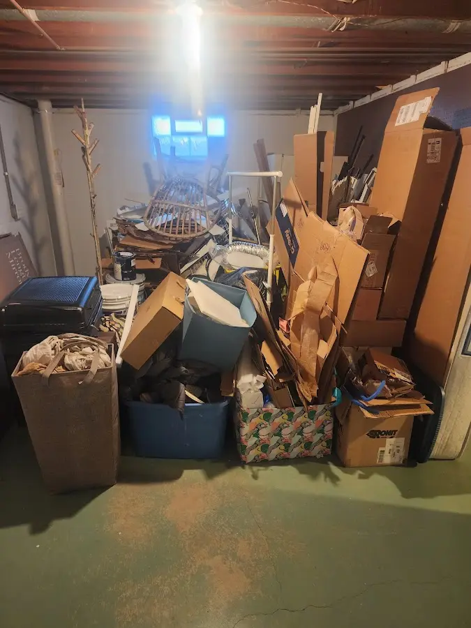 Roll-off dumpster container at job site for 15 Yard Dumpster Rental in Country Club Estates